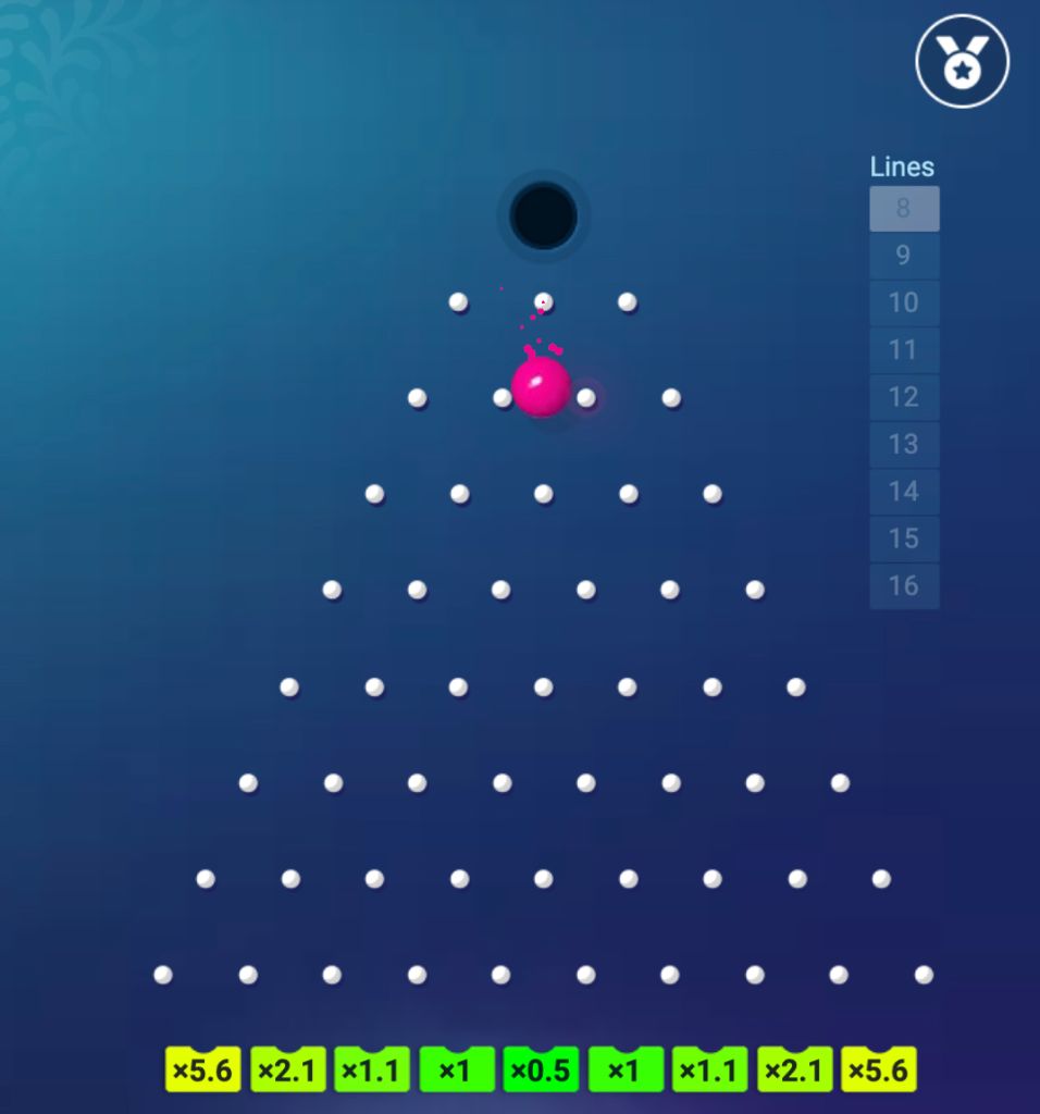 A pink Plinko ball bouncing through the pins mid-drop